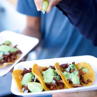 a man eating a taco