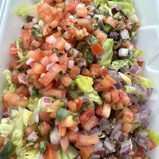 Bowl, hamburger, black beans, rice, lettuce, pico, onion. They had more to choose from.