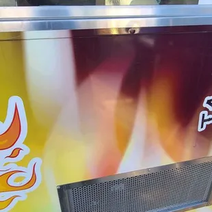 a taco truck with hot peppers on it