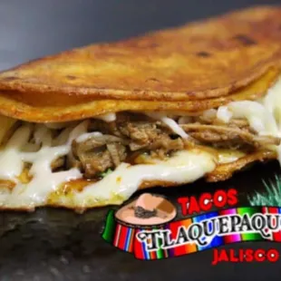 a taco filled with meat and cheese