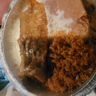 Sorry for the shadow - we were eating out in our van, at 9pm... Chicken Chimichanga with beans and rice