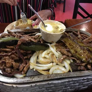 Parillas for two with 2 baked potoatos also