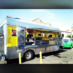 a food truck parked in a parking lot