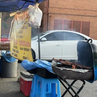 a grill with a lot of smoke coming out of it