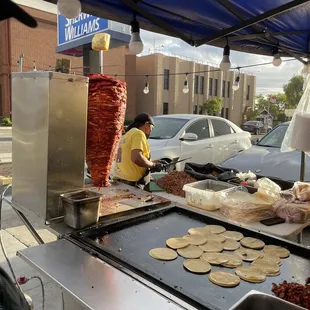 a woman making tacoss
