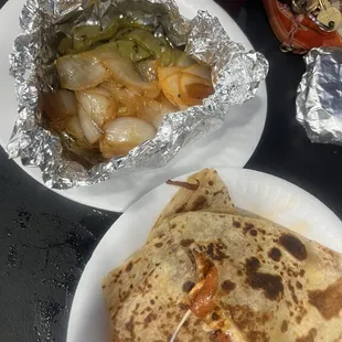 Grilled onions and grilled nopales with quesadilla