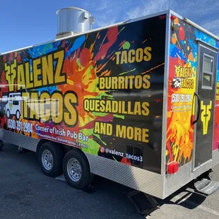 a taco truck parked in a parking lot
