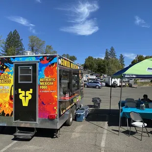 a taco truck parked in a parking lot