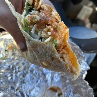 Pastor super burrito, entire thing wrapped and then toasted on the grill. Yummmmm $13