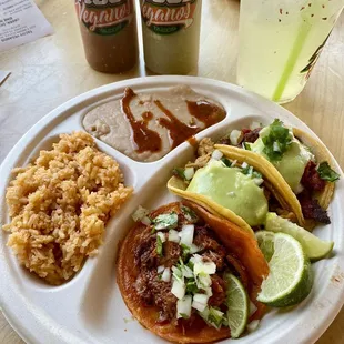 Taco plate with rice and beans. Birria, Pollo and Al Pastor. So good!!