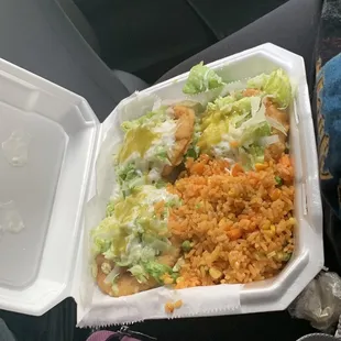 a takeout container of mexican food