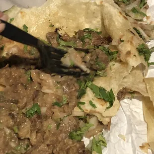 Carne asada burrito with lots of onions even after I requested no onions