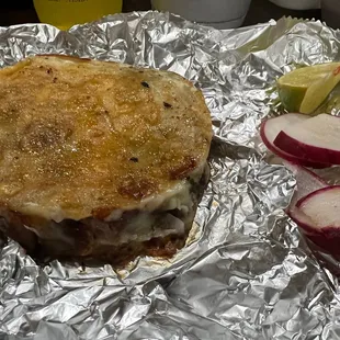 Mulita = grilled meat &amp; cheese sandwich in corn tortillas. Best eaten there else it steams in the foil $5.    4*