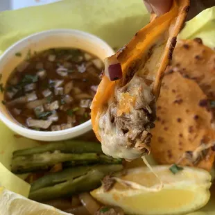 Birria tacos with a side of consume