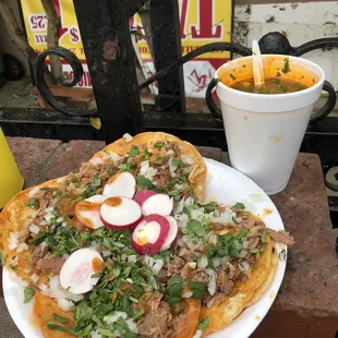 Estilo Enchilado (highly recommend) birria and barbacoa tacos . Consomé on the side to either pour over tacos or dunk tacos in.