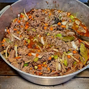 a pot of shredded beef and vegetables