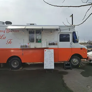 an orange and white food truck