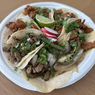 Asada and Al Pastor tacos to go. $3 each, good portions of meat. Delicious!! Wish they had the nachos.