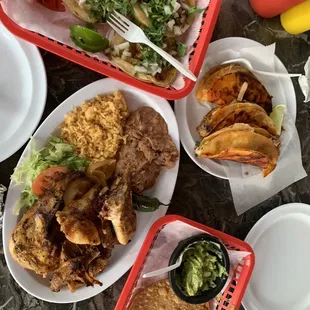 Birria tacos, guacamole, half chicken, other tacos