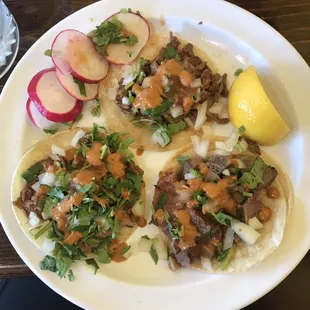 Three street tacos. Bierra, lengua, and asada.