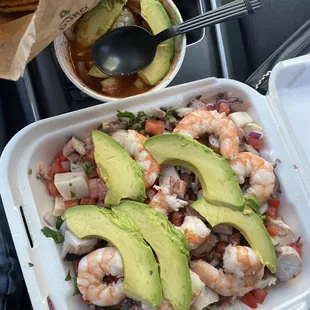 a tray of shrimp and avocado