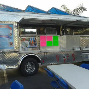 a tacos truck parked in a parking lot