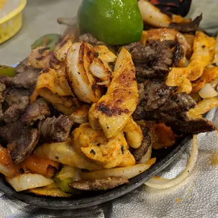 Chicken, beef, and shrimp fajitas