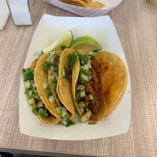 a plate of tacos and chips
