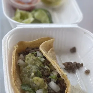 a close up of a taco in a styrofoam container