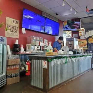 a view of a restaurant counter