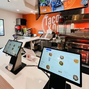 a restaurant counter with two computers