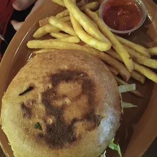 Enormous cheeseburger and fries.