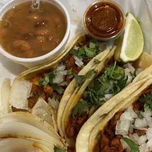 Tacos al pastor with complimentary beans