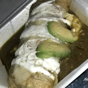 Wet chili verde burrito (to go) avocados slid off.
