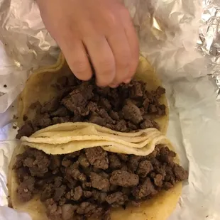 My son reaching for fajita! We got without onions or cilantro.