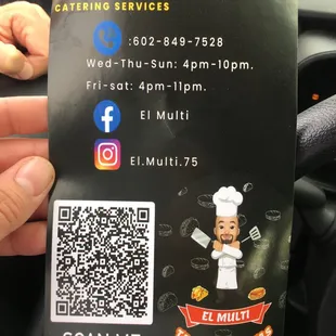 a person holding up a qr code