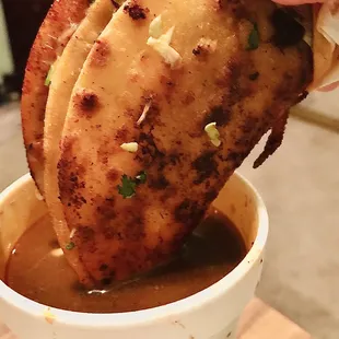 The tall cup of consomé!