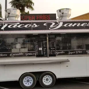 a taco truck parked in a parking lot