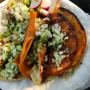 Tacos: pastor, asada, barbacoa, and queso birria