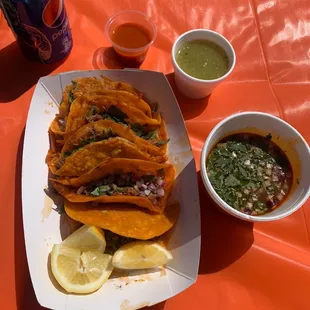 Quesabirrias, salsa roja, salsa verde, and consome