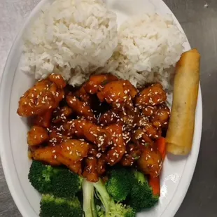 a plate of food with rice and broccoli