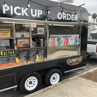 a pick up truck parked on the side of the road