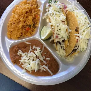 Beef tacos, beans, rice. Delicious.