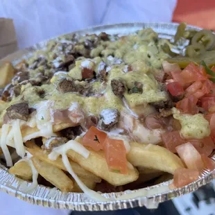 Carne Asada Fries (these were one of the employees. I just had to take a picture of it. He said they&apos;re amazing. Trying this next!)