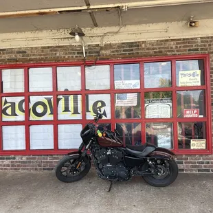 a motorcycle parked in front of a store