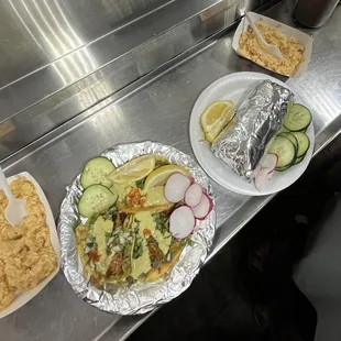 pollo tacos and carnitas burrito