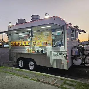 a food truck parked on the side of the road