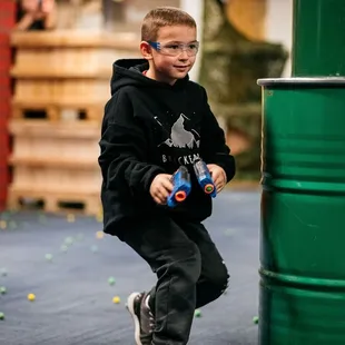Quick feet, quicker wits! This sharpshooter darts through the arena, ready for action at Tactical Urban Combat!