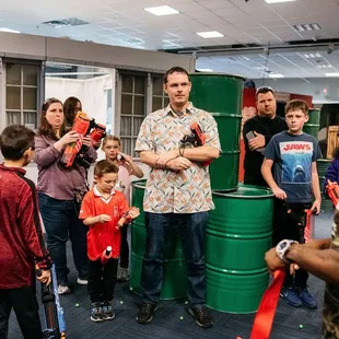 Players of all ages gear up for adventure at Tactical Urban Combat. Excitement awaits around every corner