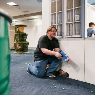 Adults join the fun too! Tactical Urban Combat - where you strategize, aim, and conquer in the Nerf arena.